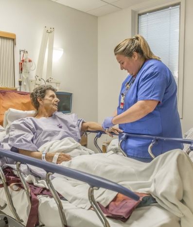 Nurse helping patient